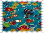 Clowning around  cotton printed  fishes on blue ground